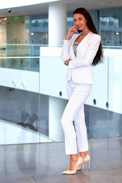 Pretty businesswoman in an office — Stock Photo, Image