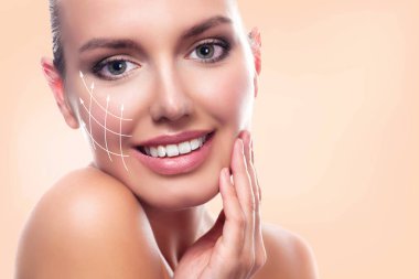 Closeup shot of young beautiful woman face portrait with healthy skin. Pretty girl smiling to you clipart