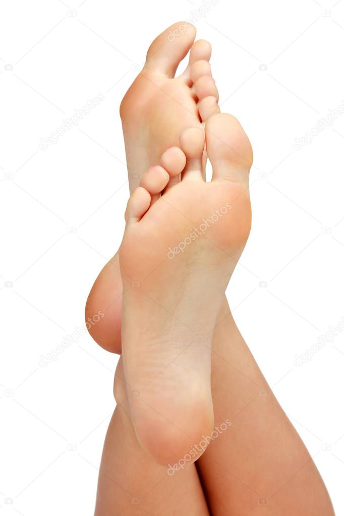 Closeup shot of female feet isolated on white background. 