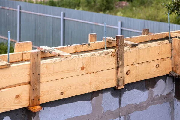 Wooden formwork concrete strip foundation for a new house — Stock Image Wooden formwork concrete strip foundation for a new house Stock Photo