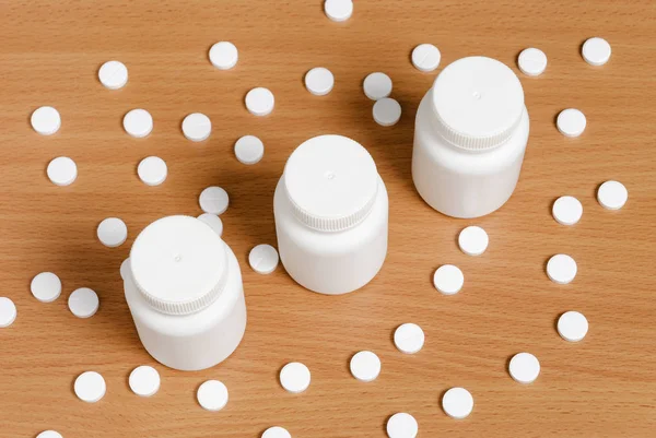 White Pills Scattered Flat Polished Wooden Surface Three Bottles Pills — Stock Photo, Image