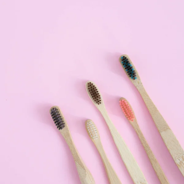 Set with bamboo toothbrushes on  background