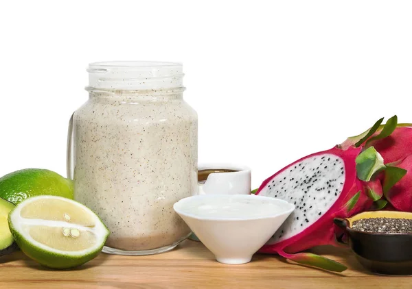 Energy smoothie in a mason jar with ingridientes on a wooden cut — Stock Photo, Image