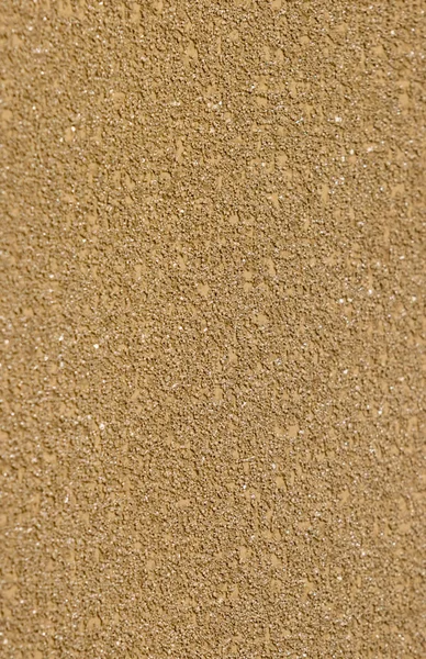 The texture of painted design gold wall. Plaster wall background.