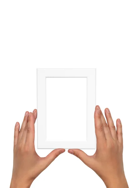 Moldura de foto branca em mãos femininas. Modelo de quadro vazio . — Fotografia de Stock