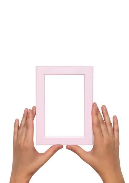 Moldura de foto rosa em mãos femininas. Modelo de quadro vazio . — Fotografia de Stock