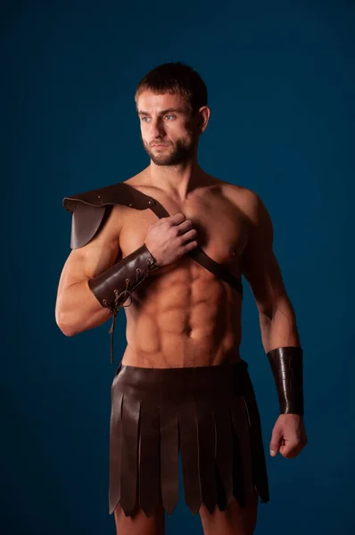 Muscled male model in warriors suite