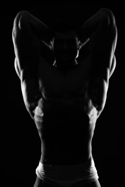 Silueta Oscura Hombre Fuerte Sobre Fondo Negro — Foto de Stock