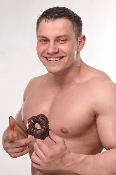 Fitness Male Model Ieating Donut — Stock Photo, Image