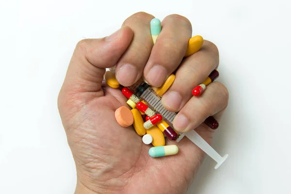 Mão cheia de comprimidos — Fotografia de Stock