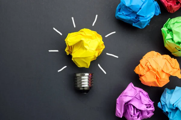 Great idea concept with crumpled colorful paper and light bulb — Stock Photo, Image