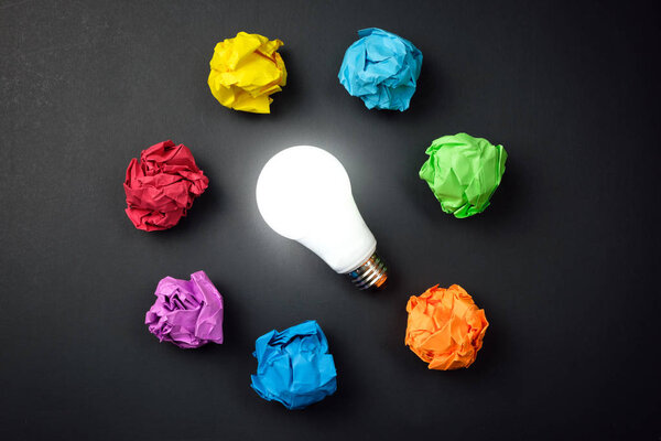 Great idea concept with crumpled colorful paper and light bulb