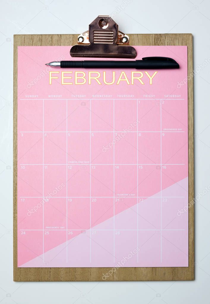 February month calendar on clipboard