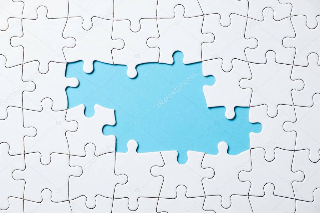 Jigsaw puzzle game piece on blue background for business theme design