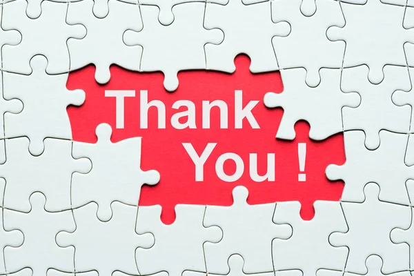 Thank you word reveal under jigsaw puzzle — Stock Photo, Image