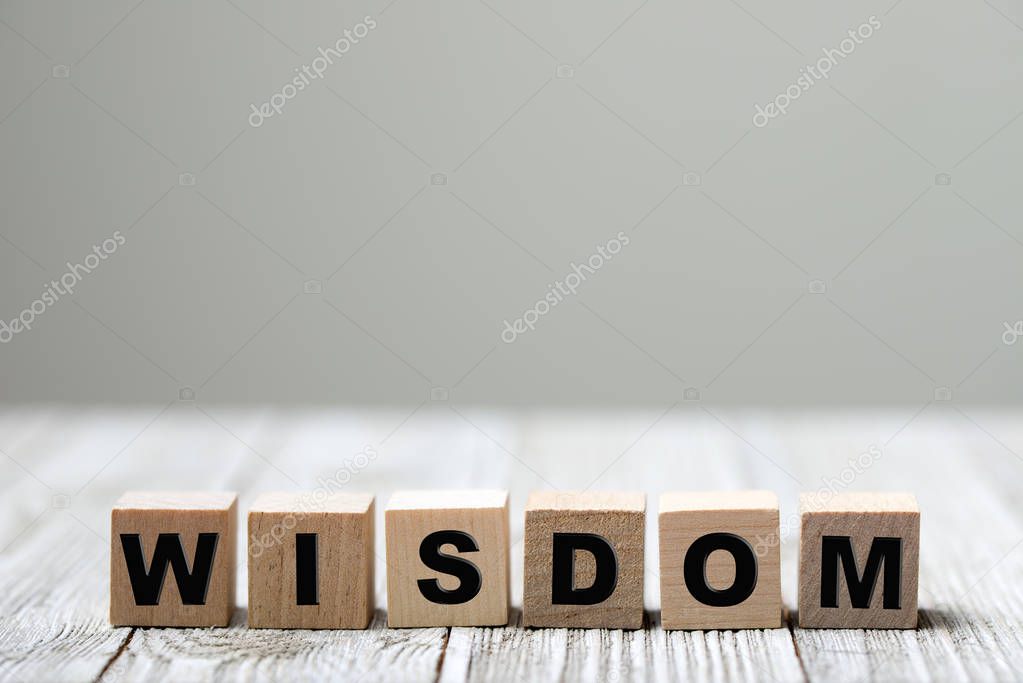 Wisdom word written on wood block