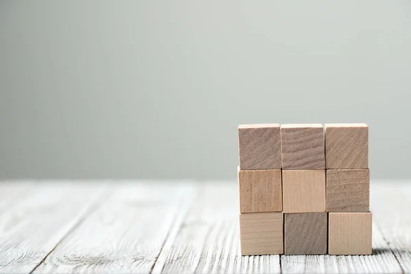 Negen houten blokken gerangschikt in kubus — Stockfoto