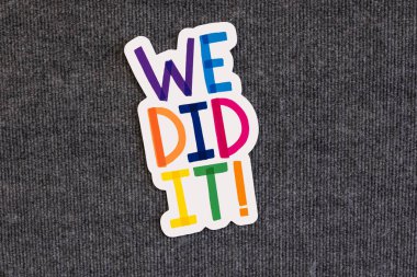 We did it slogan on blackboard with colorful alphabets. clipart