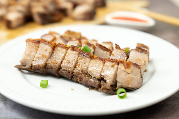 Roasted pork belly served in white plate
