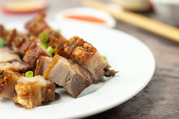 Roasted pork belly served in white plate