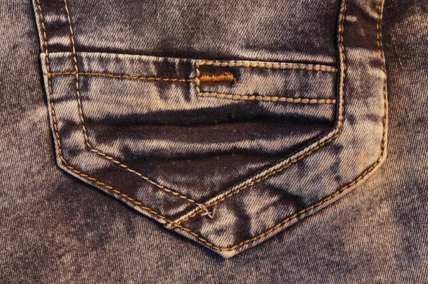 Back pocket of brown jeans. — Stock Photo, Image