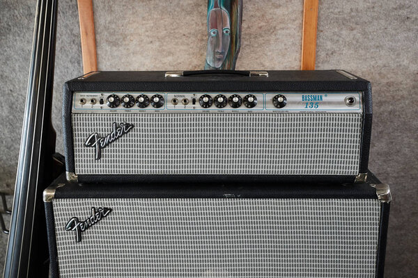 HOFN, ICELAND - MAY 4, 2018: Fender Bassman 135 vintage amplifier head on a big speaker cabinet