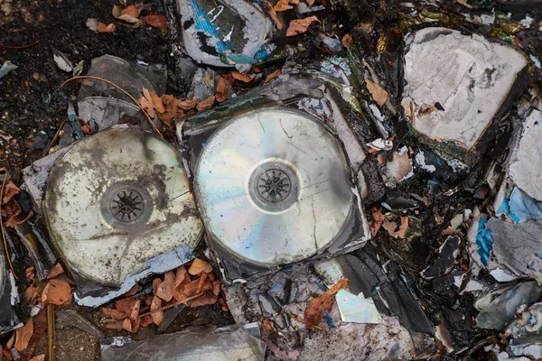 CDs thrown away in garbage dump piles — Stock Photo, Image