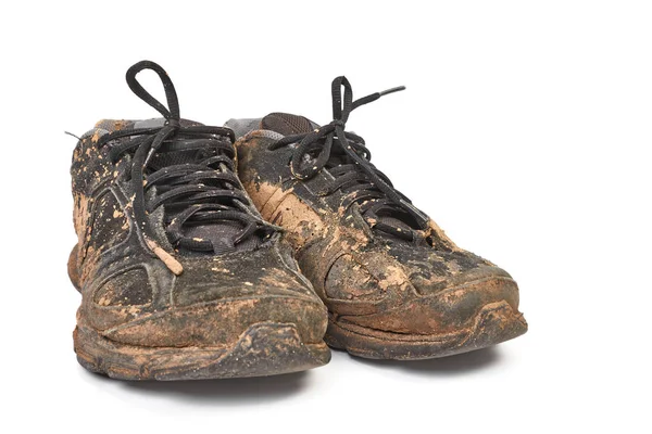 Dreckige Schuhe voller Schlamm — Stockfoto