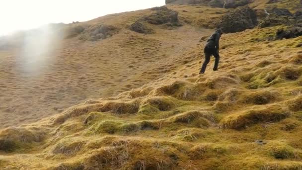 Hiking in Iceland ascending climbing hill — Stock Video