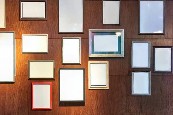 Blank picture frames on a wall gallery — Stock Photo, Image