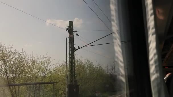Train journey window view slow motion, electric overhead — ストック動画