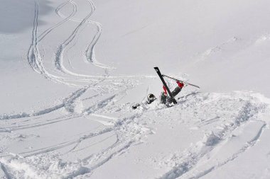 Skier falls in deep snow clipart