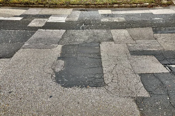 Patched broken road — Stock Photo, Image