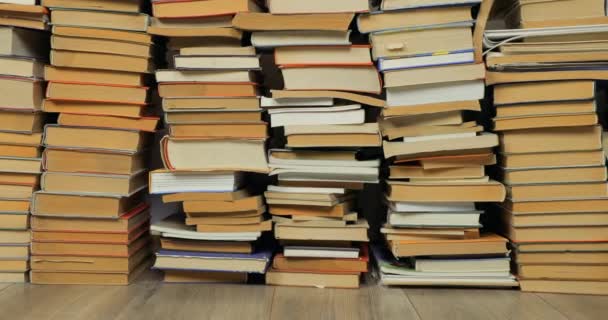 Wall of books in a pile — Stock Video