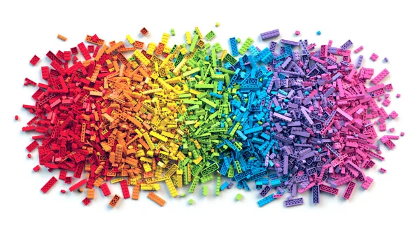 Pile of colorful rainbow toy bricks isolated on white background — Stock Photo, Image