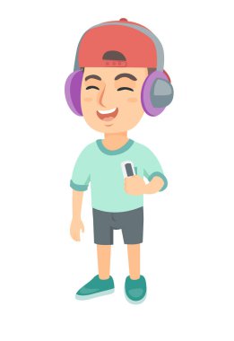 Beyaz çocuk kulaklık müzik dinlemek.