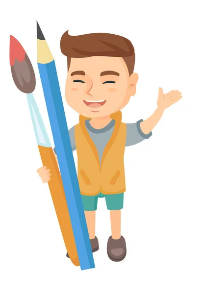 Smiling boy holding big pencil and paintbrush. — Stock Vector