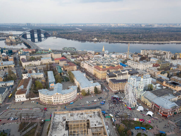  outdoor market on Kontraktova Square in Kyiv city and Ferris wheel,  historic Podil neighborhood of Kyiv