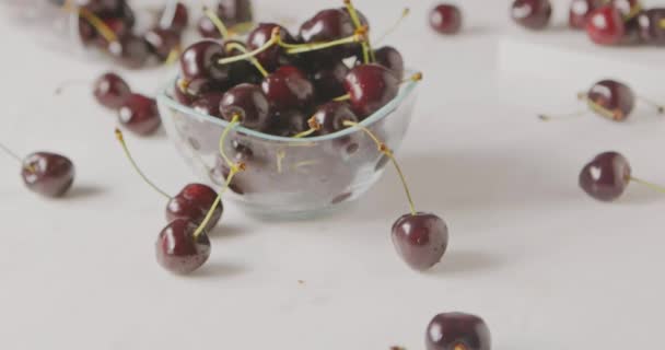 Pile Fresh Wet Ripe Cherries Small Glass Bowl White Table — Stock Video