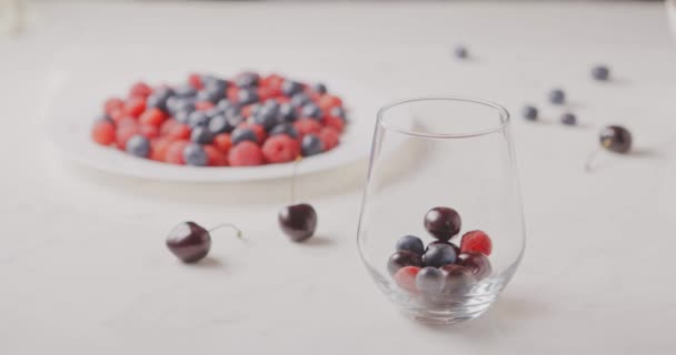 Female Hand Putting Berries Glass — Stock Video