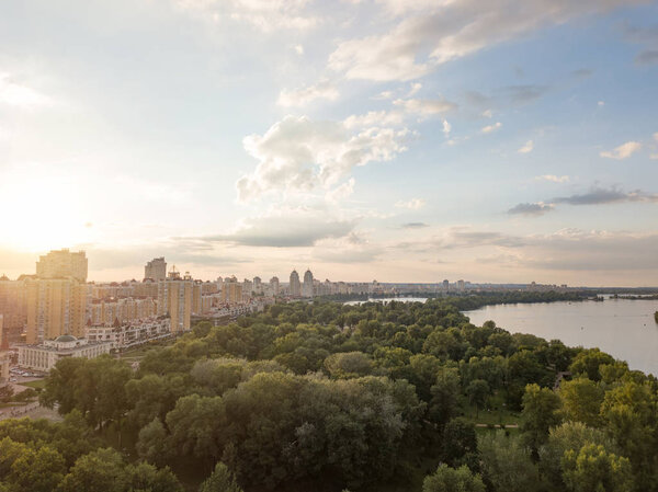 Birds eye view from the drone to Obolon, district Oasis, river Dnieper in Kiev at sunset in the summer.