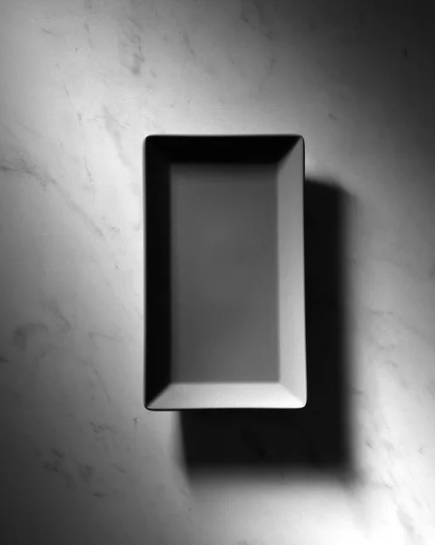 Empty Rectangular Black Plate Reflection Shadows Gray Marble Background Copy — Stock Photo, Image