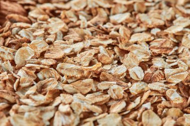 Arka plan olarak çiğ yulaf gevreği. Yakın çekim, görünümü, yüksek çözünürlüklü ürün yumuşak odak ile top. Sağlıklı gıda kavramı.