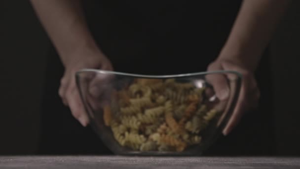 Woman Throwing Macaroni Out Glass Bowl Table Concept Italian Food — Stock Video