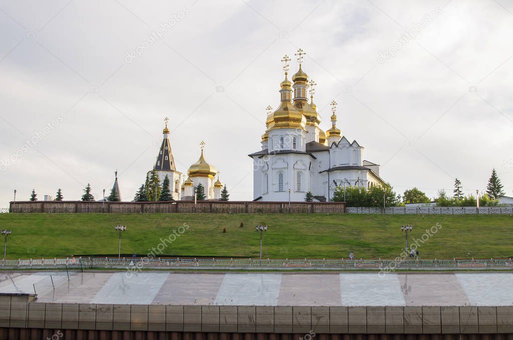 Tura River Embankment in Tyumen, Russia. Holy Trinity Monastery