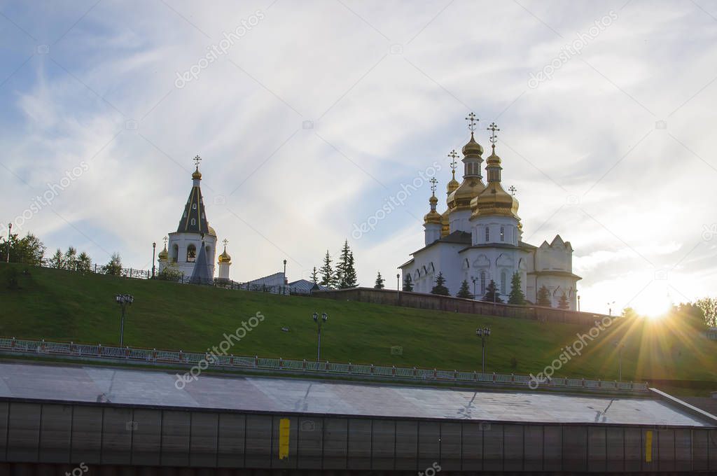 Tura River Embankment in Tyumen, Russia. Holy Trinity Monastery