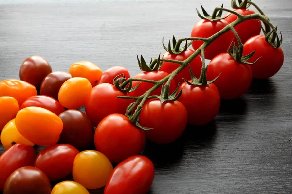 Cherry Tomatoes Black Table High Angle View Close — Stock Photo, Image