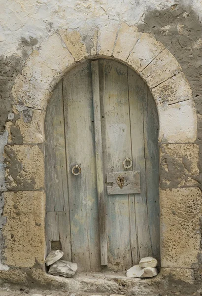 Very old wooden arc door in arabian style. Local arabian Culture and architecture