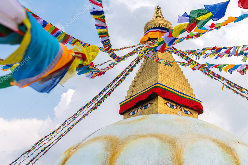 Boudhanath Stupa and prayer flags in Kathmandu, Nepal. Buddhist stupa of Boudha Stupa is one of the largest stupas in the world