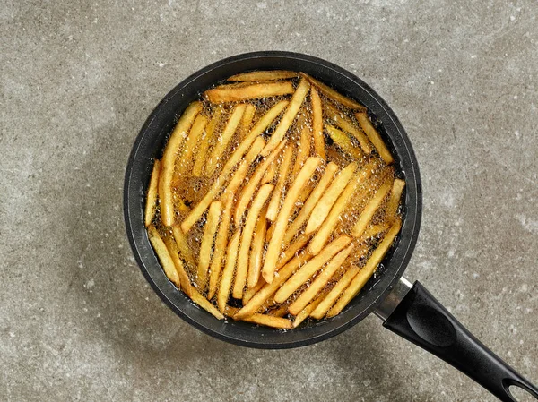 Frying french fries — Stock Photo, Image